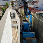We go the extra mile. Which might be using a crane in a one way street. Delivery of e hotttub using a crane in a small one way street at the Algarve.