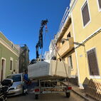 Even when there is little space, there's always space for a hottub. Car trailer with hot tub in a small small one way street at the Algarve.